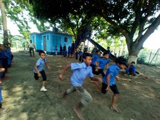 A group of children running on a dirt road

Description automatically generated