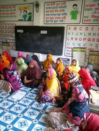 A group of women sitting in a classroom

Description automatically generated