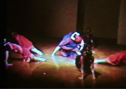 A group of people dancing on a stage

Description automatically generated