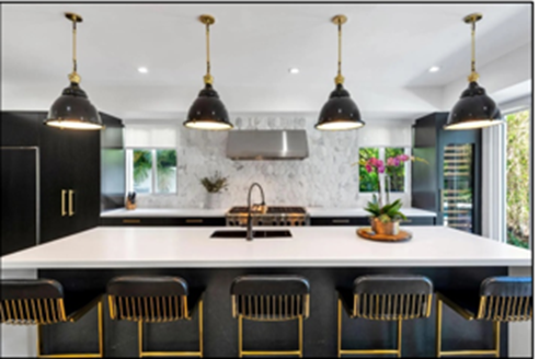 A kitchen with black and gold chairs with Churchill Downs in the background

AI-generated content may be incorrect.