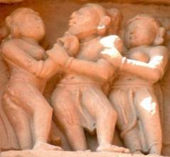 A stone carving of a group of people

Description automatically generated