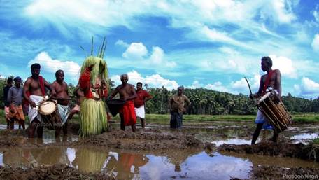 A group of people standing in a muddy field

Description automatically generated with low confidence