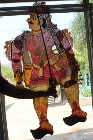 A person holding a puppet

Description automatically generated with low confidence