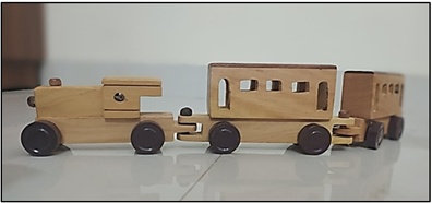 A wooden toy train with a train pulling a train

AI-generated content may be incorrect.