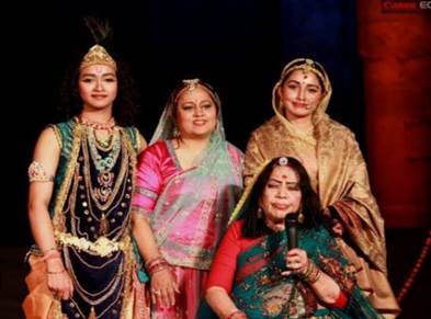 A group of women wearing traditional clothing

Description automatically generated