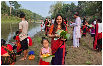 Chakmas Offering Flowers to Maa Ganga on Phool Bizu 
