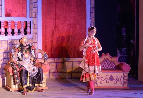 The demoness or rakshasi Putona (centre) in her form as a young woman (Mohini Putona) promises Kansa (left) that she can kill the baby Krishna