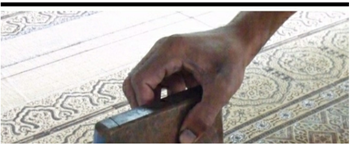 A close-up of a hand holding a metal object
AI-generated content may be incorrect.