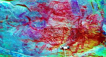 A high angle view of a rock painting

Description automatically generated