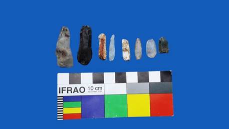A group of stone objects and a sample card

Description automatically generated with medium confidence