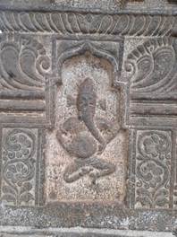 A stone carving of a person

Description automatically generated