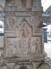A stone sculpture with carvings

Description automatically generated with medium confidence