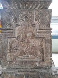 A stone carving of a person

Description automatically generated
