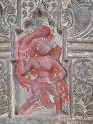A stone carving of a person

Description automatically generated