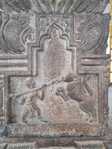 A stone carving of a cross

Description automatically generated with medium confidence