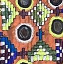 A colorful dress on a rug

Description automatically generated