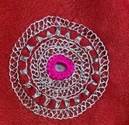 A red fabric with a pattern

Description automatically generated