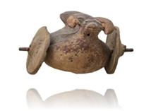 A close-up of a clay pot

Description automatically generated