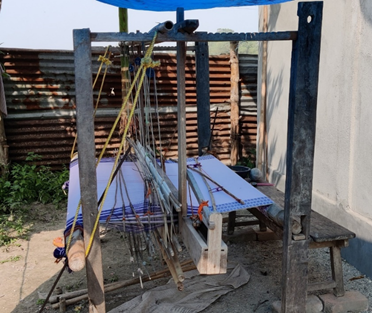 A loom on a stand

Description automatically generated