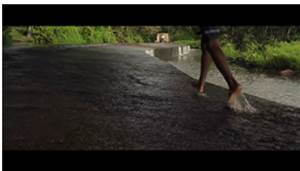 A person walking on a road

Description automatically generated with medium confidence
