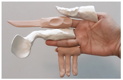 A close-up of hands holding a roll of toilet paper

Description automatically generated with low confidence