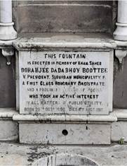 A stone plaque with writing on it

Description automatically generated