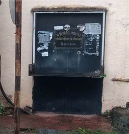 A door with a hole in the wall

Description automatically generated