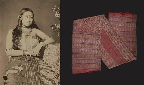 A person sitting on a couch next to a few pieces of fabric

Description automatically generated