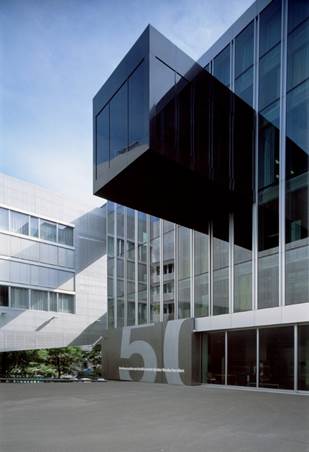 A picture containing building, sky, outdoor, commercial building

Description automatically generated