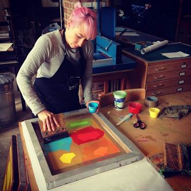 A person painting a picture

Description automatically generated