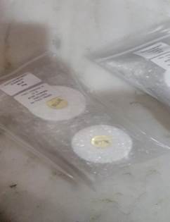 A pair of plastic bags with white circles

Description automatically generated