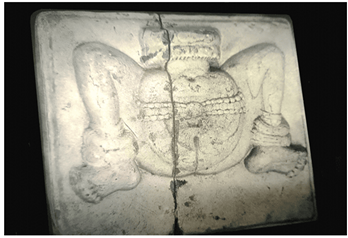 A stone carving of a human body

Description automatically generated
